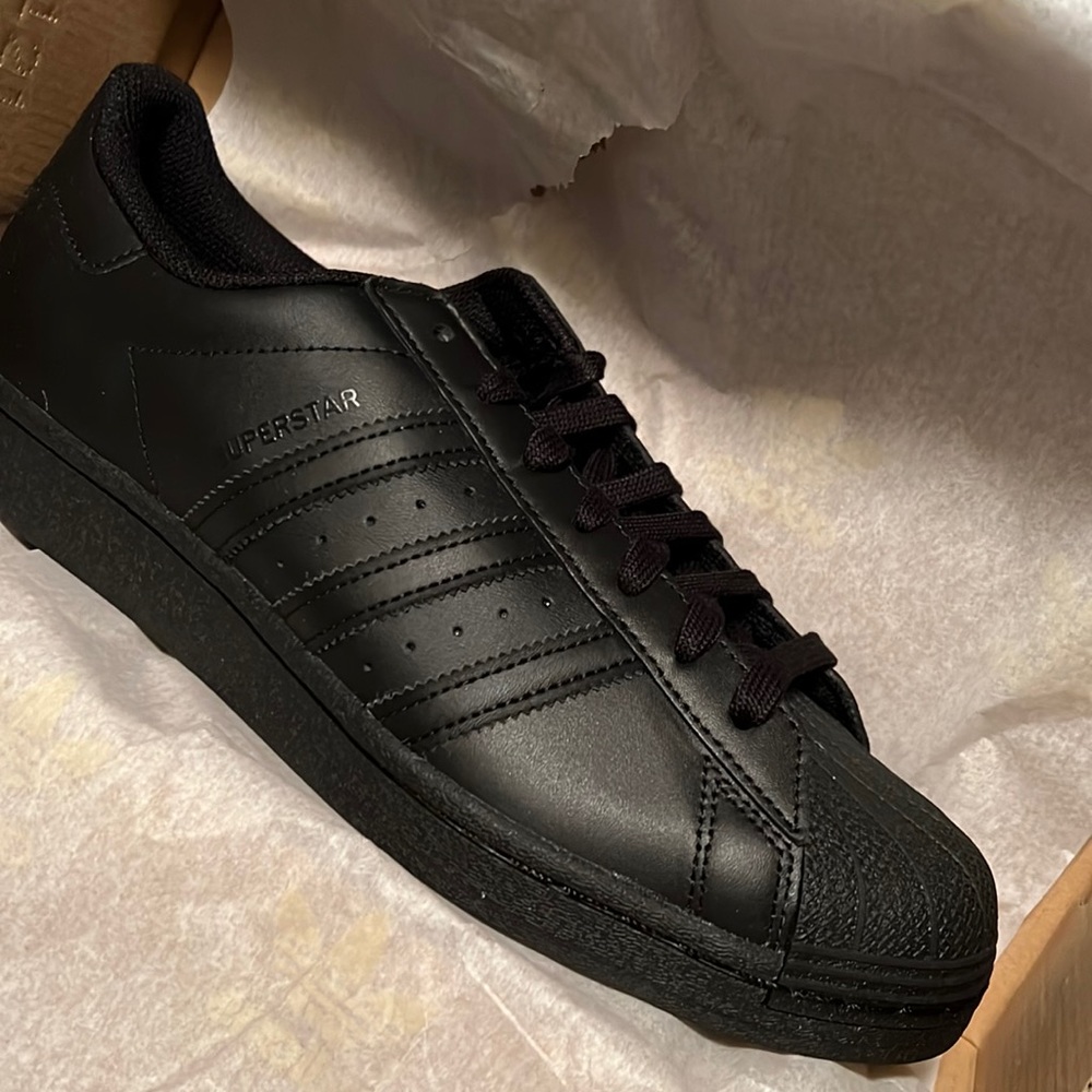 Triple black adidas superstar with tags and box